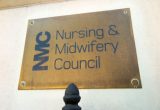 A close up of a sign reading NMC, Nursing and Midwifery Council