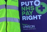Cropped version of an image of a Unison worker on strike in 2022